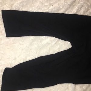 A solid black unitard romper